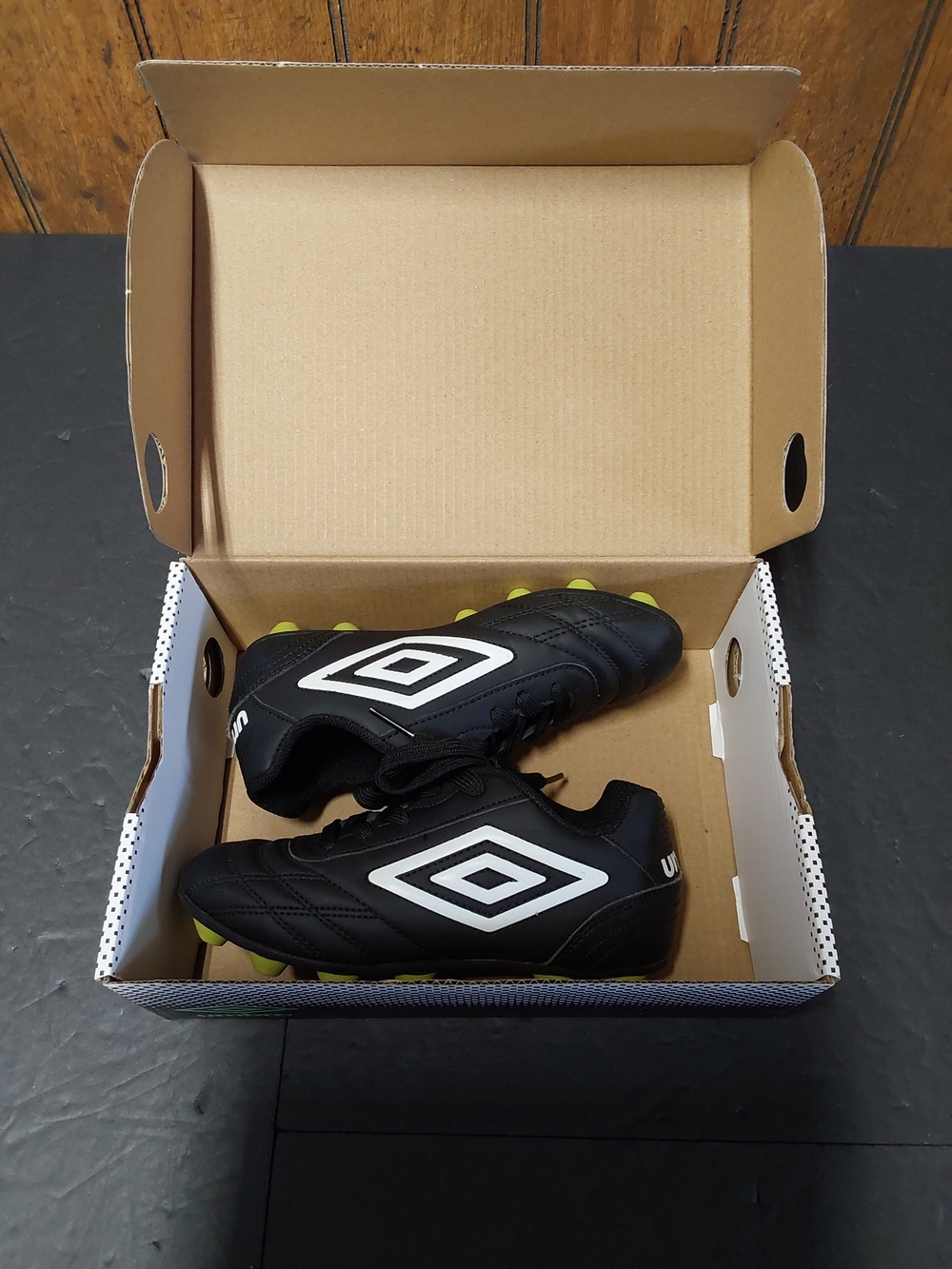 Umbro Kids Black Soccer Cleats with White Logo and Neon Studs